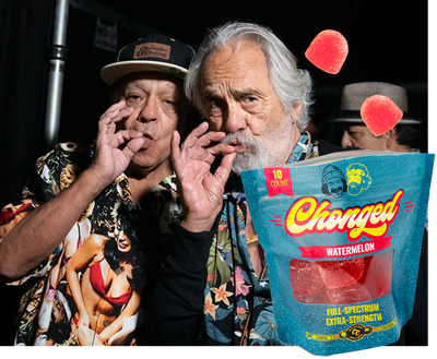 Two men with a 'Chonged' watermelon candy bag in a casual setting